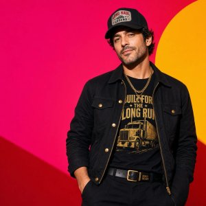 photos-people-editorial-portraits · Confident High Fashion Portrait Of Truck Driver Against
